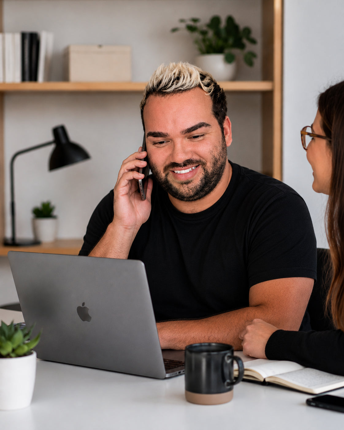 Viber consultant on the phone working on a laptop